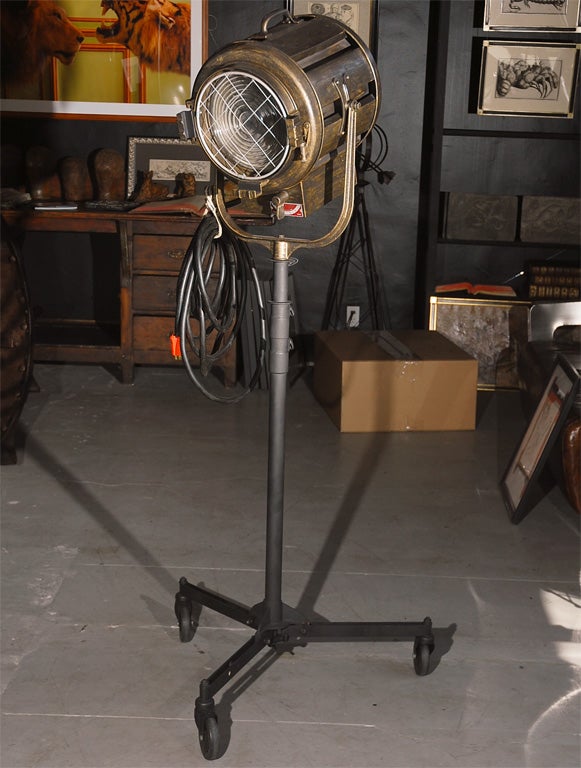 A genuine lamp used on Hollywood movie sets in the 1960s. An obsolete design by Mole-Richardson Co. With the flip of a switch this lamp can shift from spotlight to floodlight—the bulb is either advanced or retracted along a track inside the lamp