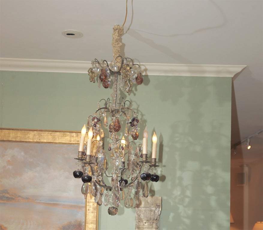 Third Quarter 19th Century French Six Light Gilt Bronze Chandelier, Elaboratly Decorated with Hand Cut Amethyst Glass Grapes and Apples, Smoky Glass Pomegranates and Pears and Hand Cut Prisms and Pendants. <br />
Circa 1870.