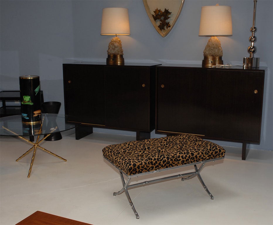 Tufted cheetah print velvet upholstered polished aluminum bench.