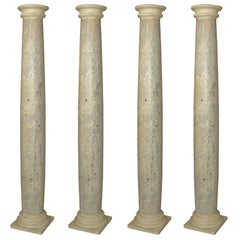 An Architectural Set of Four Faux Marble Wooden Columns