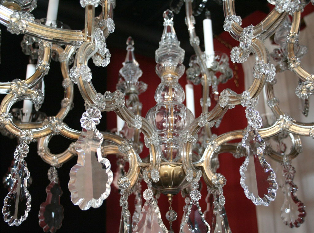 Iron Maria Teresa gilded iron and crystal sixteen light chandelier.