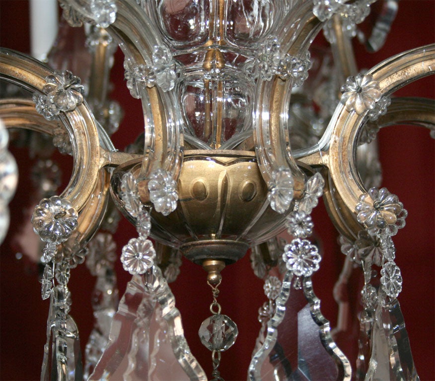 Maria Teresa gilded iron and crystal sixteen light chandelier. 1