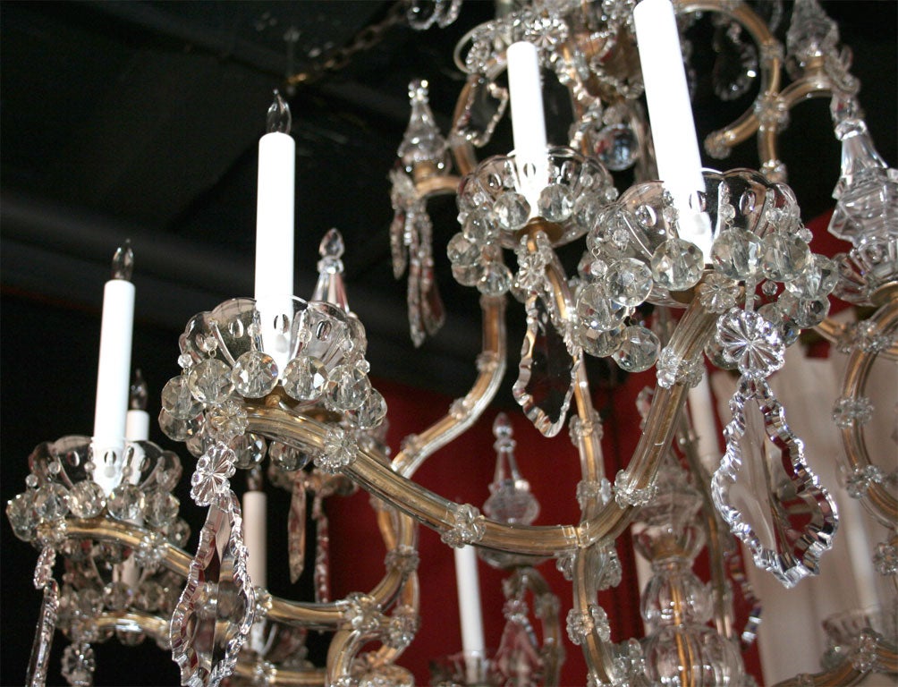 Maria Teresa gilded iron and crystal sixteen light chandelier. 2