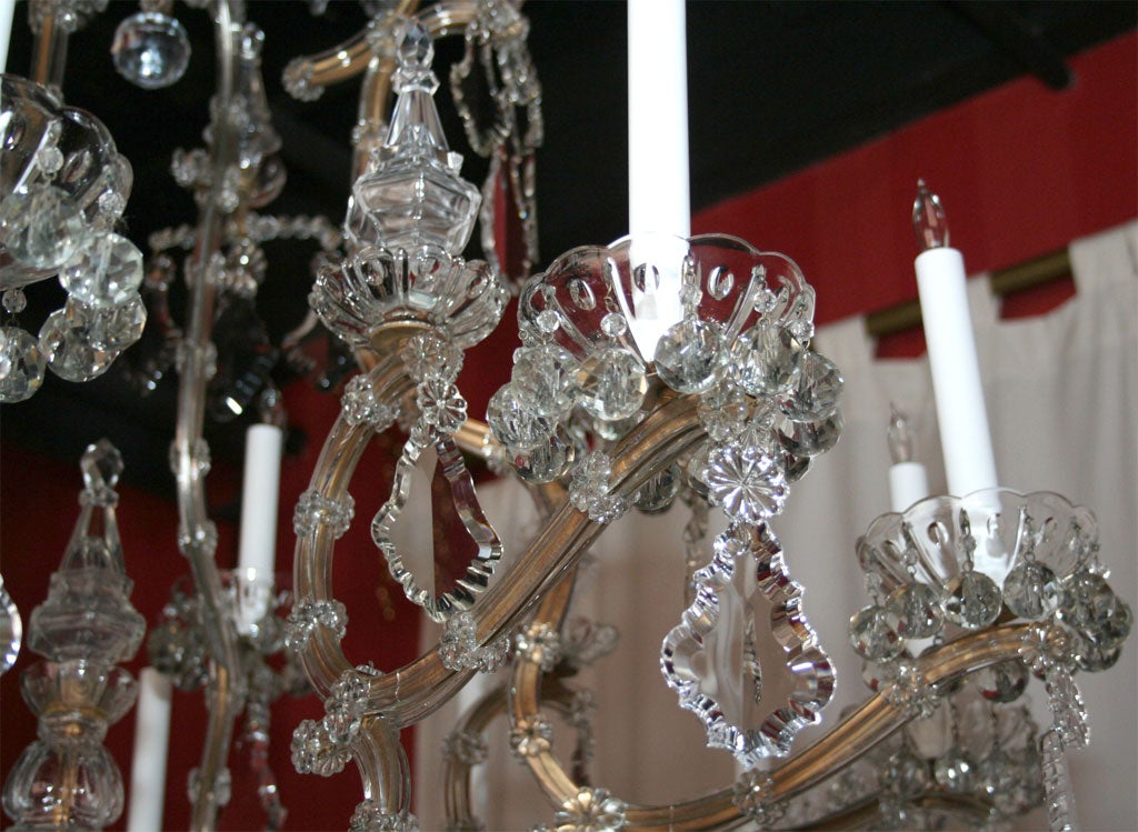 Maria Teresa gilded iron and crystal sixteen light chandelier. 3
