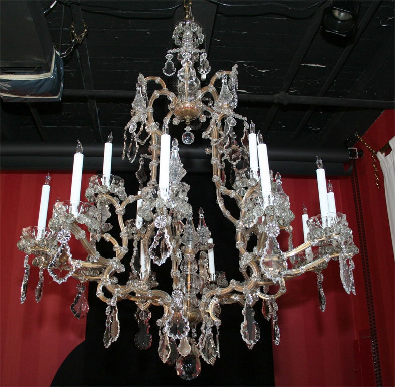 Maria Teresa gilded iron and crystal sixteen light chandelier. 5
