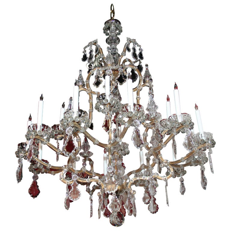 Maria Teresa gilded iron and crystal sixteen light chandelier.