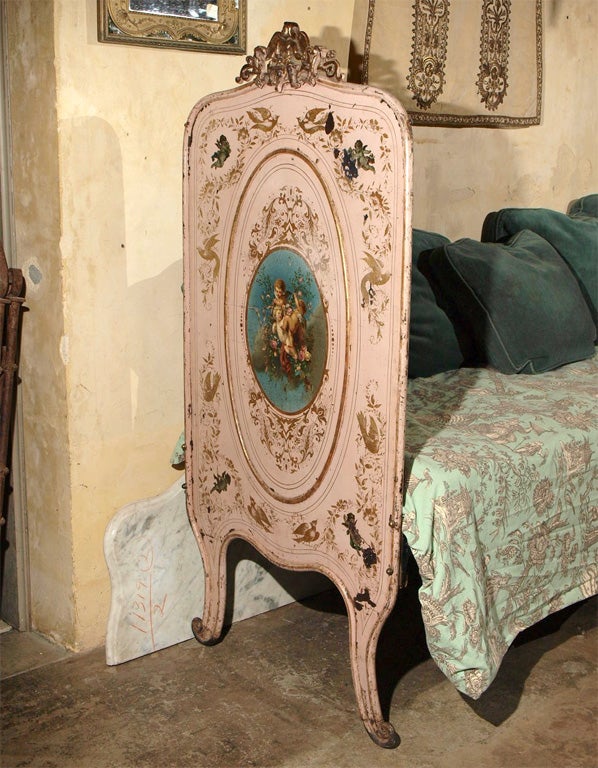 This daybed is painted pale pink and gold and has original transfers of cherubs playing, birds and flowers. The bed has newly made, custom rails.<br />
Interior measures  24.5
