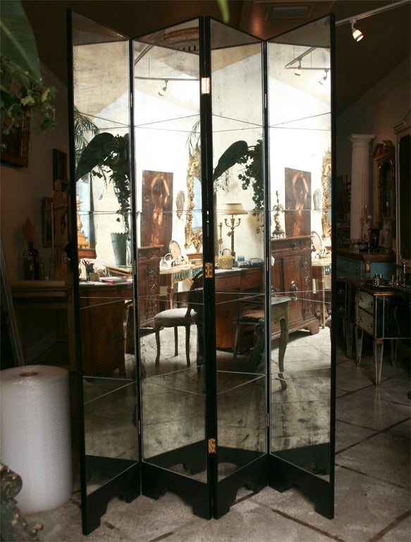 21st century mirrored screen with lightly antiqued colored mirror and black Lacquer details. Created and designed by Coco House and T&G Custom Creations.