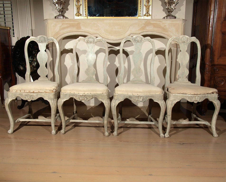 Set of four Swedish Rococo dining chairs in original patina.