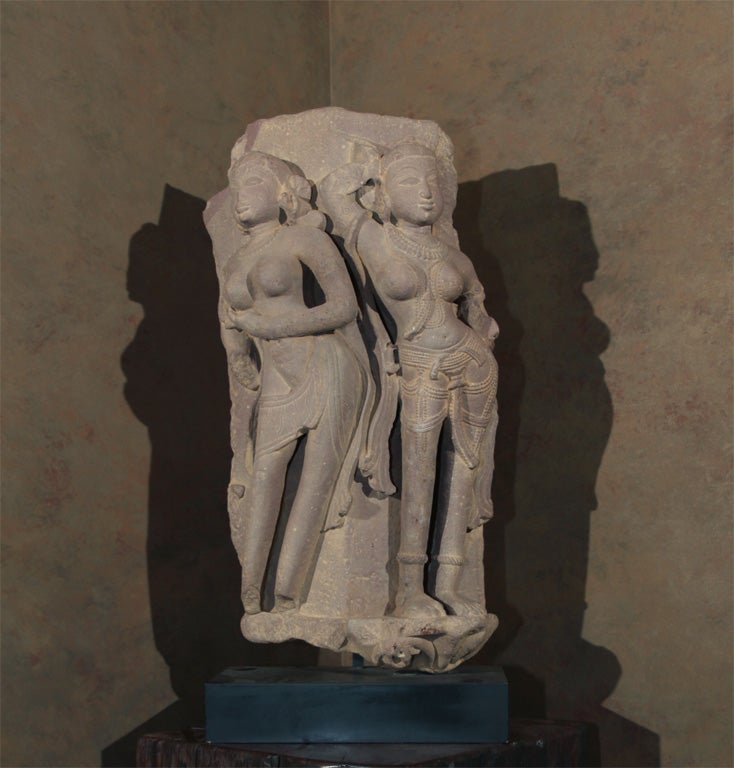 Erotic sandstone carving from the Khajuraho sites built by the Chandella culture (8th-10th centuries), judging from the overtly erotic nature of the figure on the left. Many of the Hindu sculptures from this period were mildly erotic (as opposed to