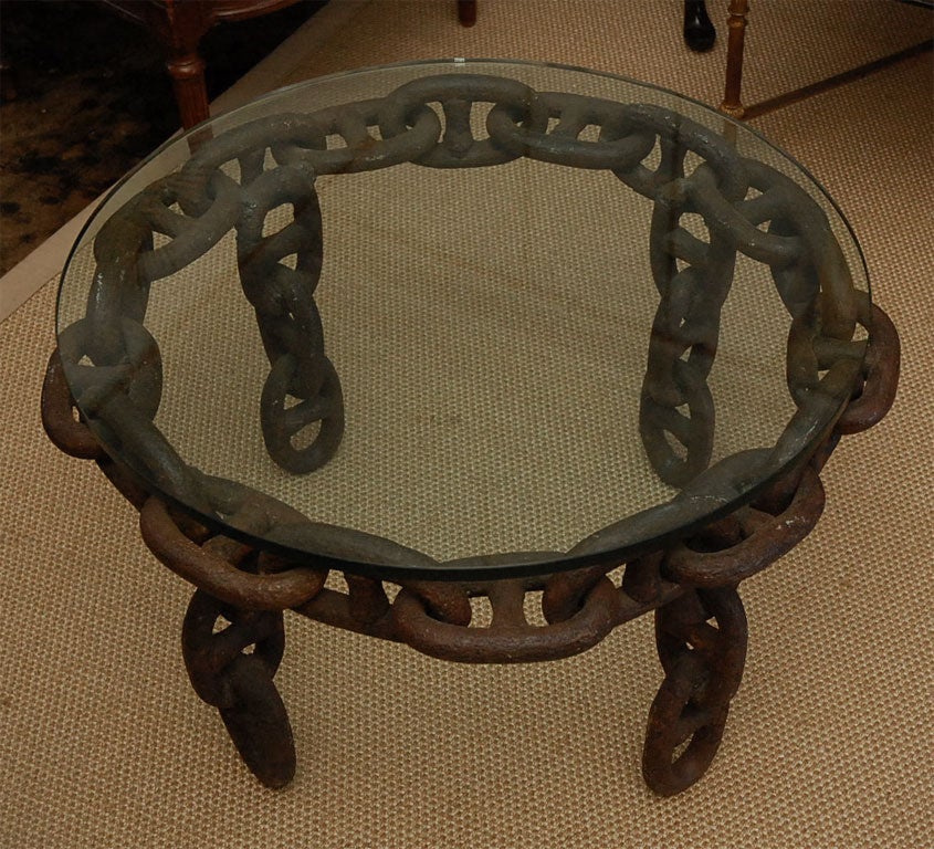 Industrial table made from huge chain links. Very sculptural. Ideal for a loft or to contrast with more classic pieces.