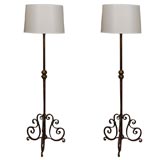 Pair of iron floor lamps in the style of Poillerat