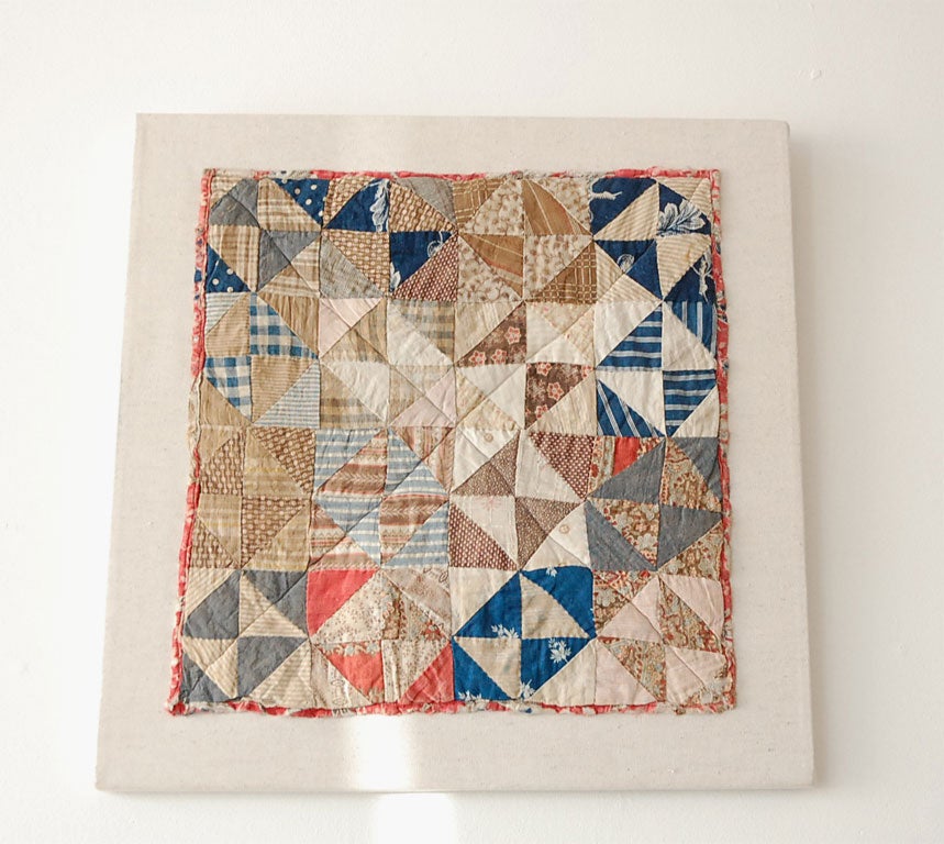 19TH C. BROKEN DISHES CHILD'S DOLL COTTON QUILT WITH A PICTORIAL CHINTZ BACKING. PROFESSIONALLY MOUNTED.