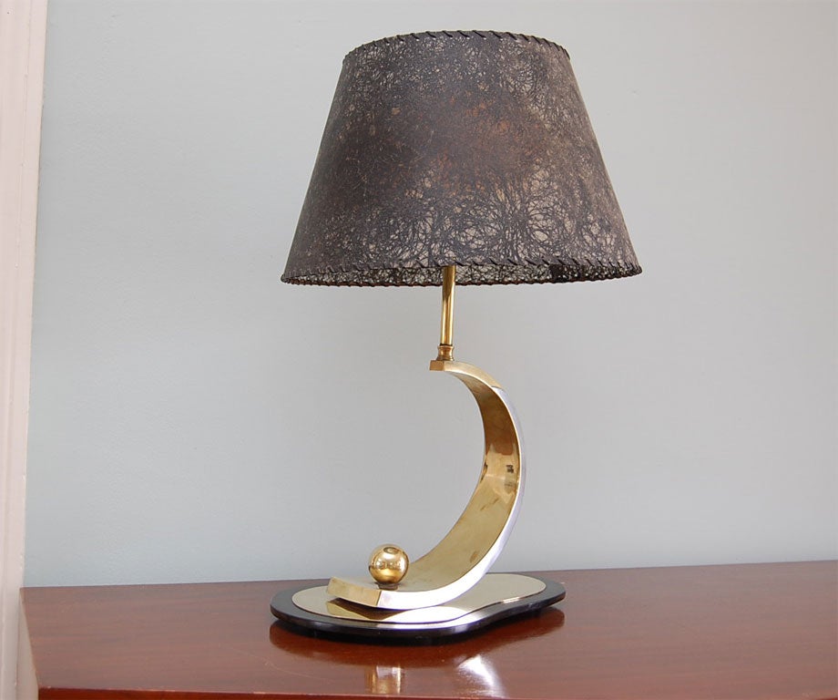 Spectacular two-light table lamp by noted Maine silversmith James B. Hamlin (b. 1894); the base in bakelite and brass; the upcurving support in brass with a pewter 