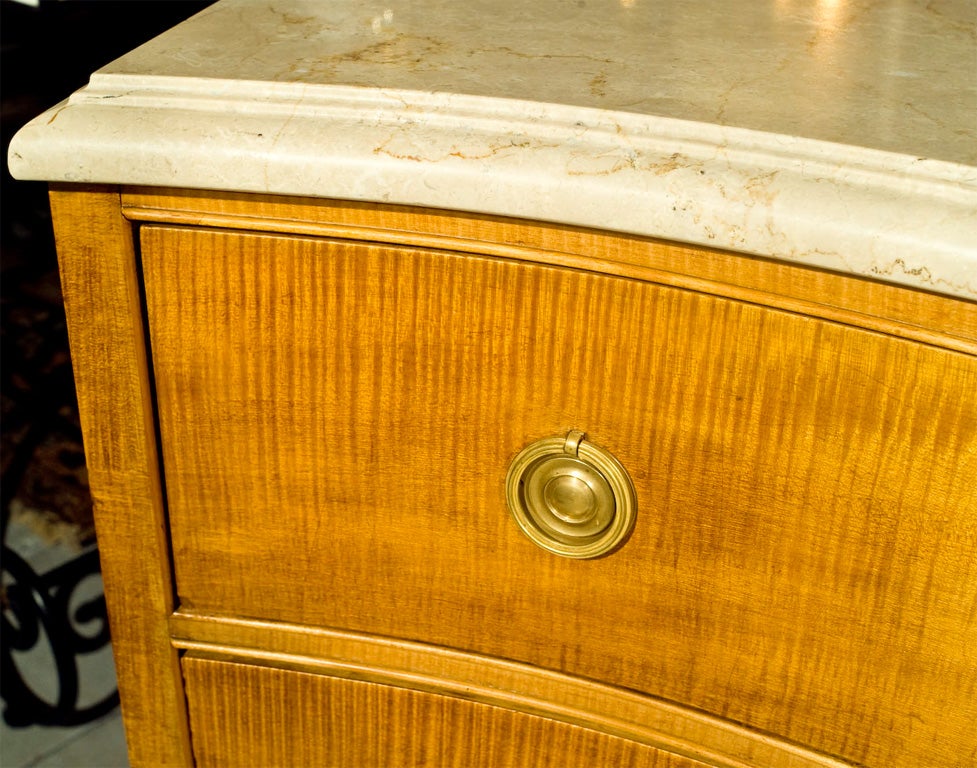 One of a kind! Fabulous Jansen stamped yew wood commode with

Marble top. The drawer with brass pulls. One of the finest quality commodes we have ever owned. Marble with metal pins for positioning.
