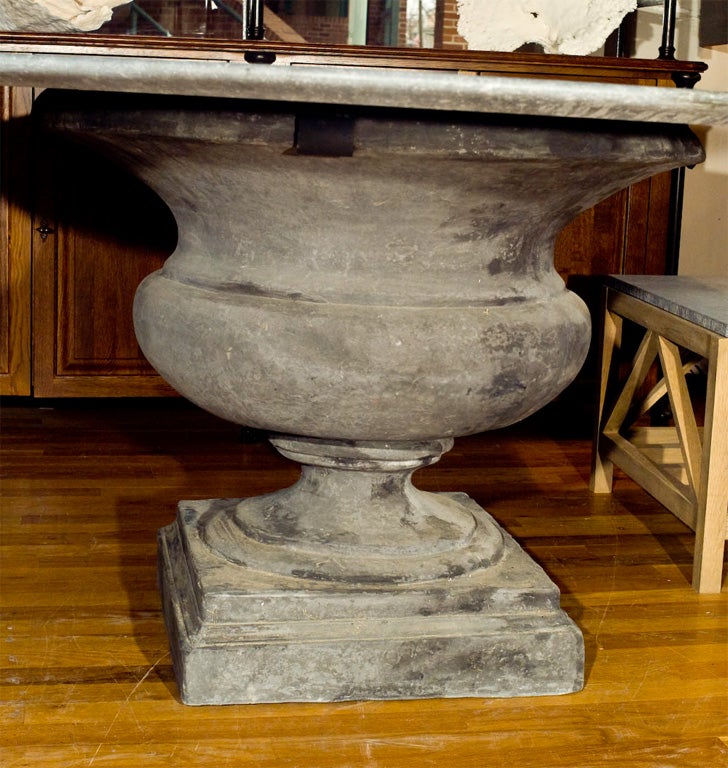 Bluestone dining table with concrete urn shaped base