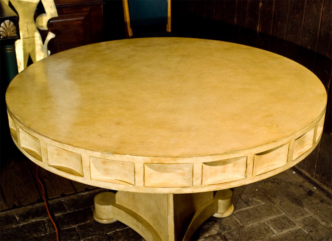 Chunky proportions on this stunning round table with a distressed faux leather finish.