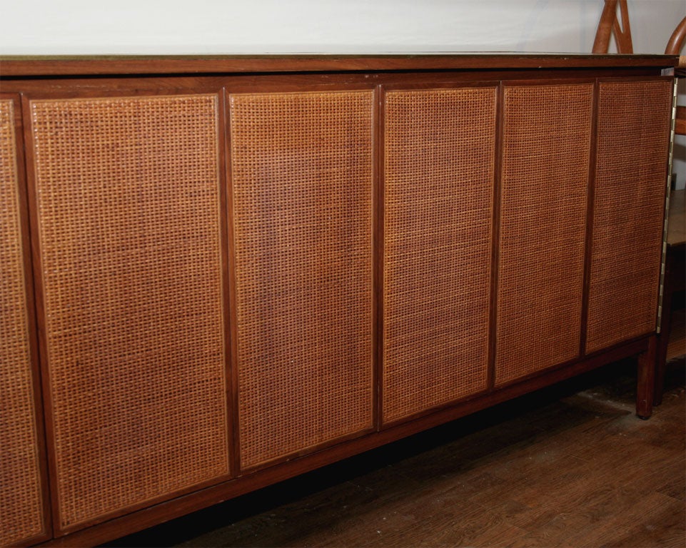 20th Century Paul McCobb walnut, cane, leather/brass sideboard, mfg. Calvin