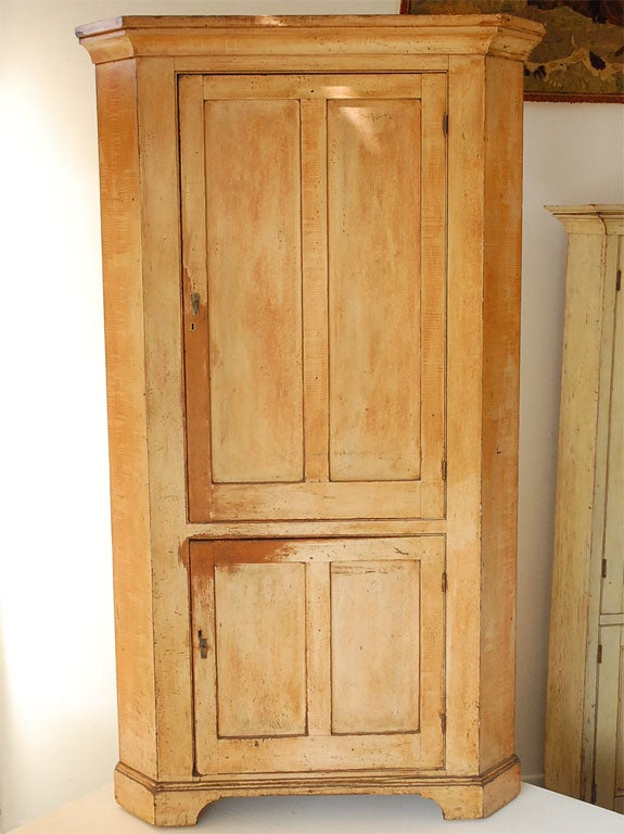 THIS 19THC CORNER CUPBOARD WAS FOUND IN PENNSYLVANIA. THE CUPBOARD RETAINS ITS ORIGINAL PAINT AND ITS WOOD PEG CONSTRUCTION. THE PAINTED WOOD IS WALNUT. THE CUPBOARD ALSO RETAINS ITS ORIGINAL HARDWARE.