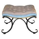 Black and gilt metal C-scroll tufted stool
