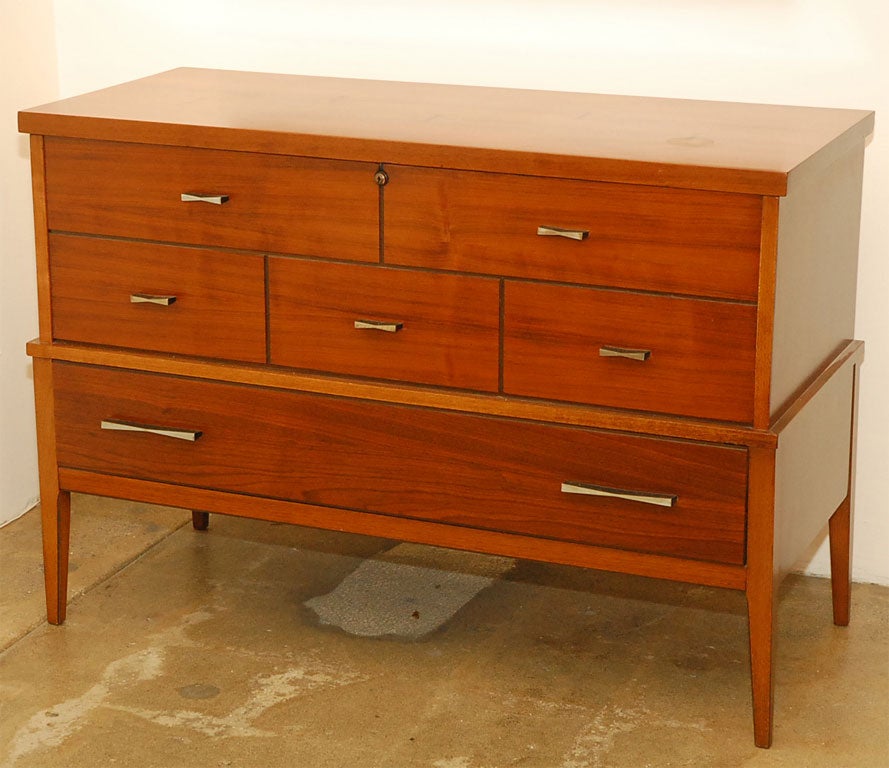 This cedar blanket chest by lane has beautiful inlayed wood accents and interesting minimalist drawer pulls that don’t draw attention from the woods natural beauty.   One large workable drawer.