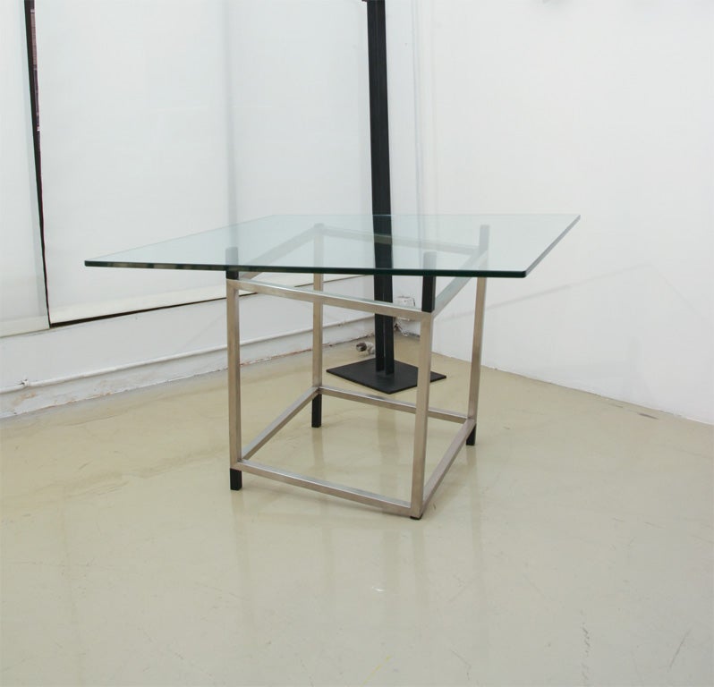 Unique table that gives optical illusion of being lopsided.