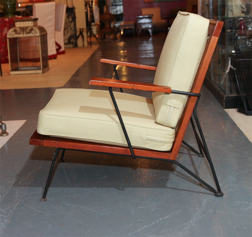 Three piece grouping -- Pair of Armchairs and a low Slat Table designed in 1949 by Saarinen Associates (Eliel Saarinen, Pipsan Saarinen Swanson, and Robert Swanson) for Ficks-Reed.  These are among several pieces called 
