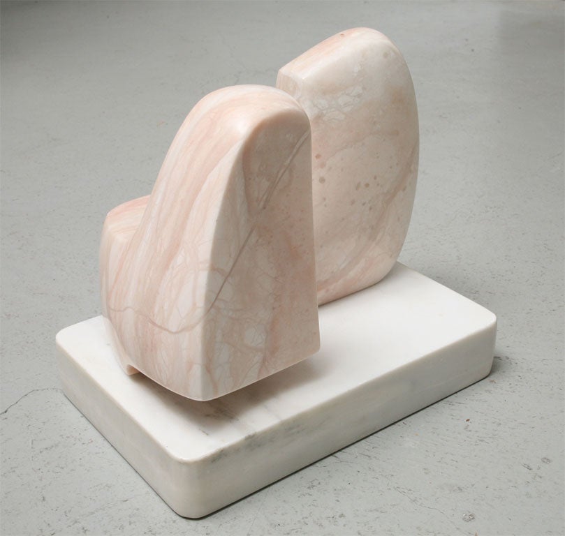 Organic Mid Century Modern Sculpture in pale pink marble with white marble plinth. Dynamic from every angle this work of art is refined and sophisticated.