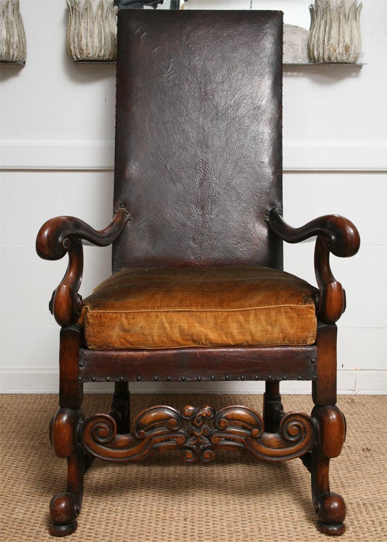 Carved frams with leather upholstery and velvet cushion