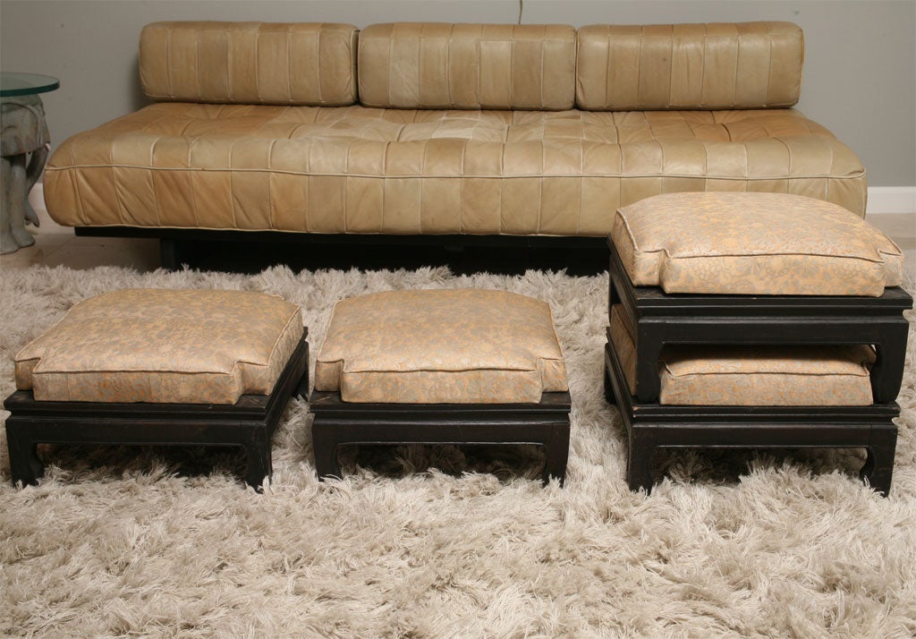 Four Stacking Footstools from China with vintage Fortuny fabric are a chic accessory for a bedroom or library.