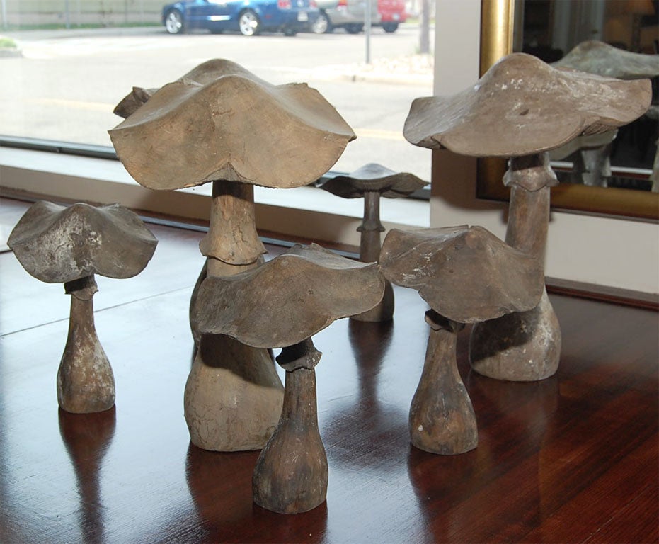 wonderful collection of seven hand carved wooden mushrooms in various sizes with a beautiful patina