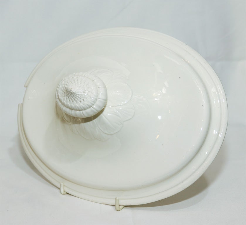 A large Spode Creamware tureen, cover and stand with impressed Spode mark has loop handles typical of Spode at this time and similar to a Wedgwood 18th century design.
This tureen is part of our collection of antique Creamware.