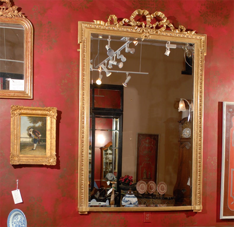 Tall 19th Century French Water Gilt Mirror w/ a Bow at the Crown