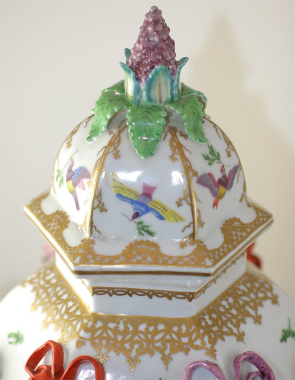 A rare Bristol porcelain hexagonal frill vase, the body and cover with applied woman's heads, ribbons, flowers and shells and brightly painted