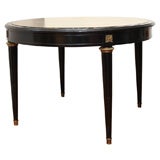 Ebonized circular table by Jansen