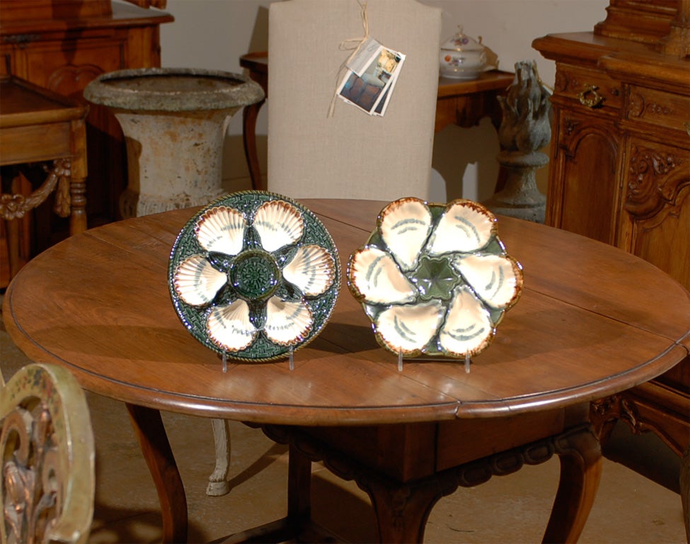 19th century French oyster and scallop plates made by Longchamp, we have several of each available.