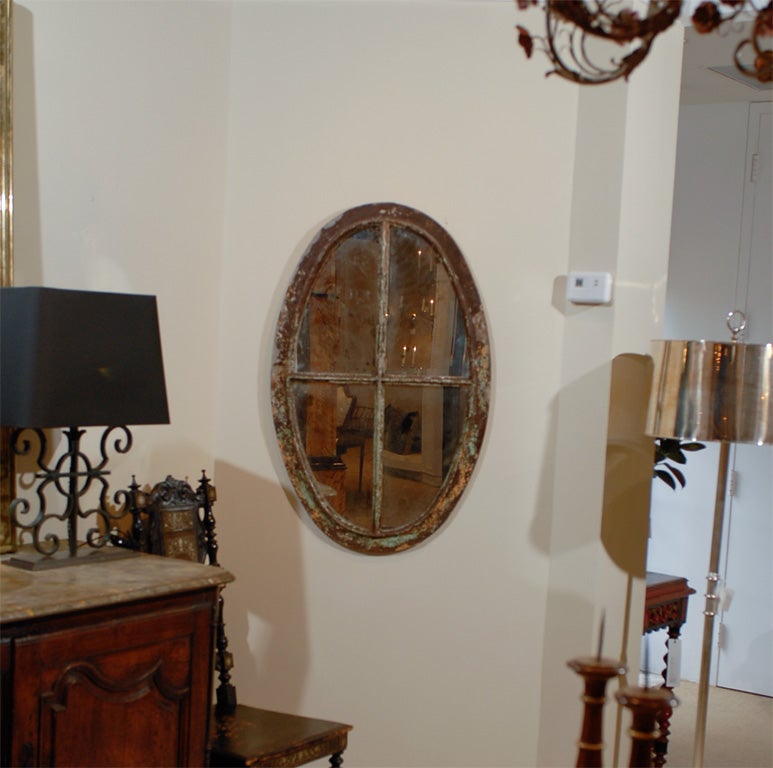 Oval Wrought Iron Window with Antiqued Mirror