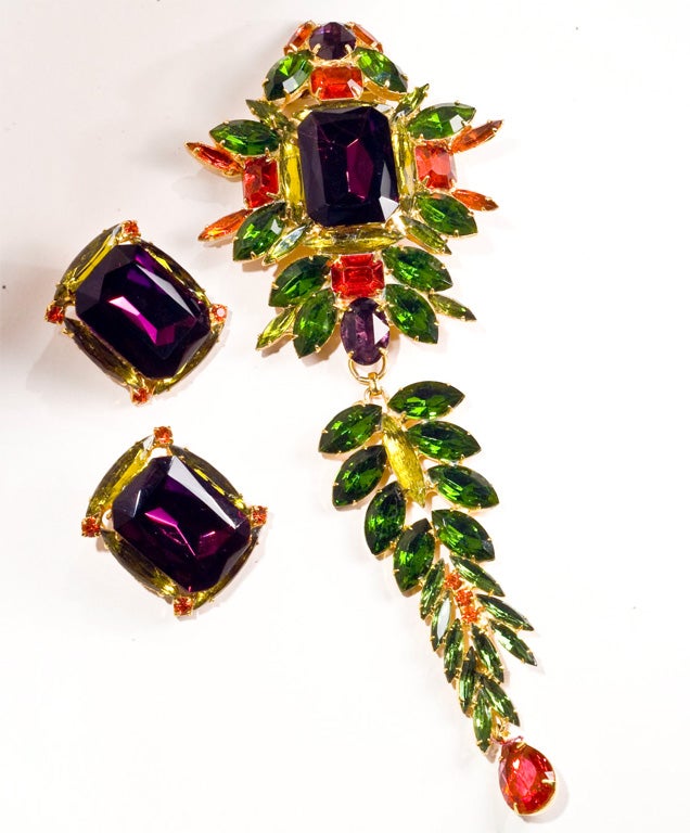 Offered here is RUNWAY jewelry.  A costume brooch, long with matching earrings 
