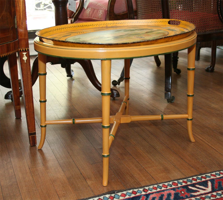 French, painted oval tole tray Ca.1820 on later stand.