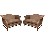 A pair of small camel-back upholstered settees
