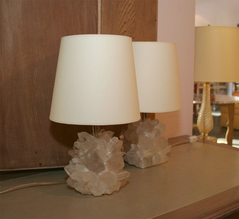 Pair of small table lamps in rock crystal with twisted-silk cord and paper shades.
Lampshade not included.