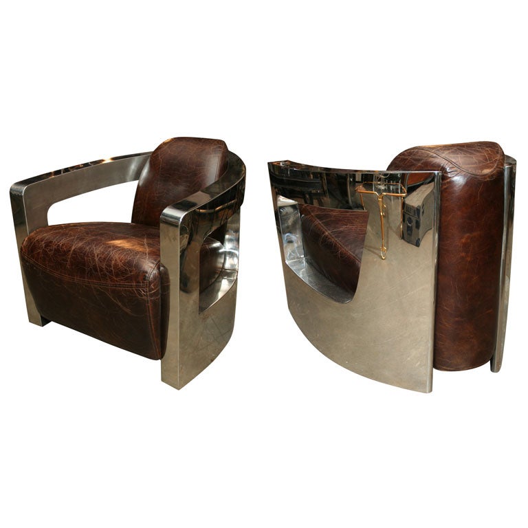 Superbes fauteuils de style déco en cuir et acier poli