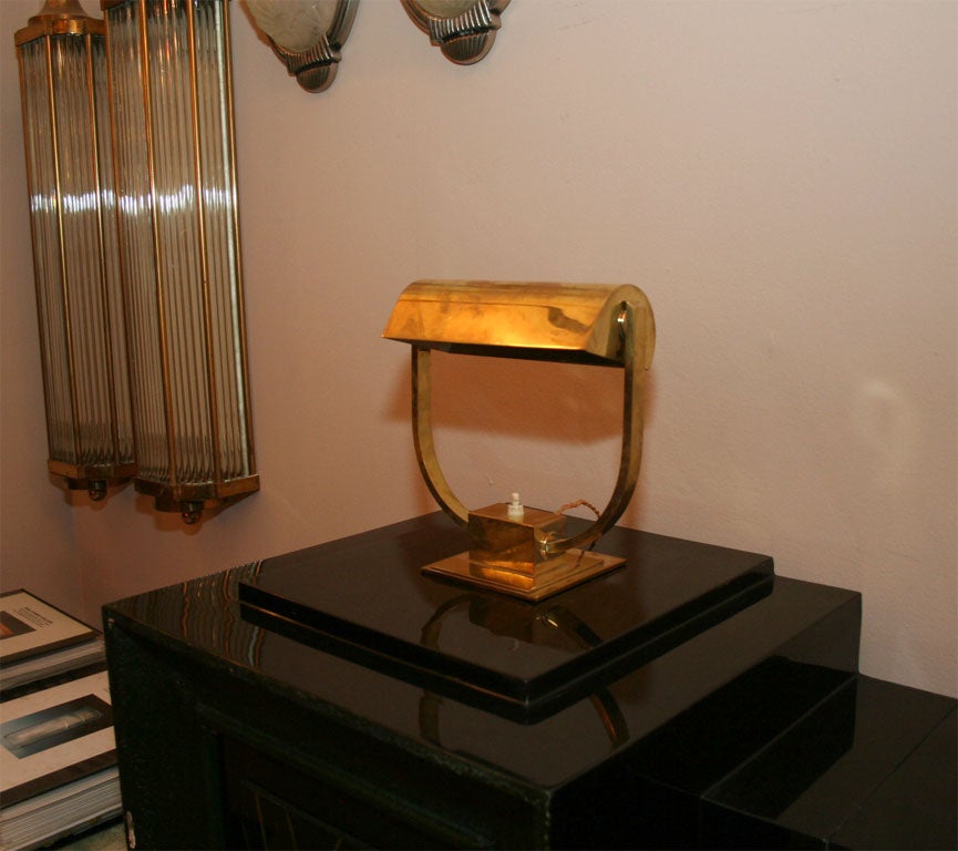 An Art Deco Desk Lamp attributed to Jacques Adnet, from circa 1930's, in gilt bronze.