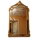 Antique French gold leaf and bevelled glass mirror.