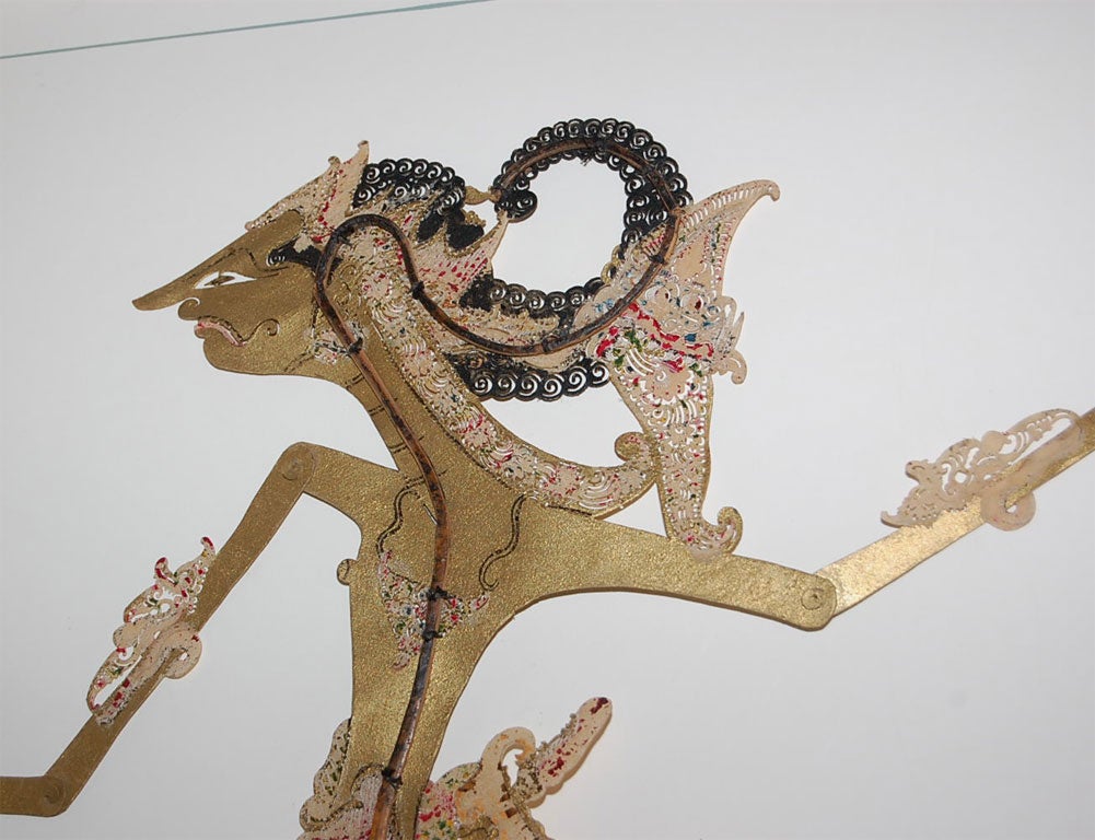 Javanese Shadow Puppet is Incised, Pierced and Painted Metal.  It is Mounted and Framed.