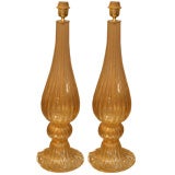 Elegant pair of gold murano lamps .