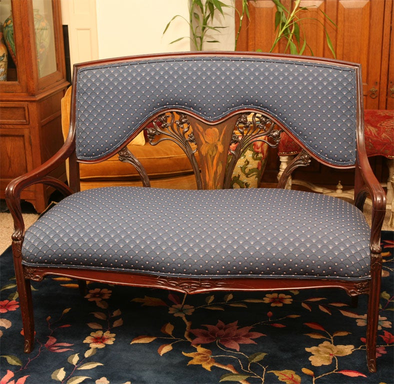 Mahogany upholstered setee or couch with graceful legs,  carved and fruitwood inlays depicting  flowering irises.