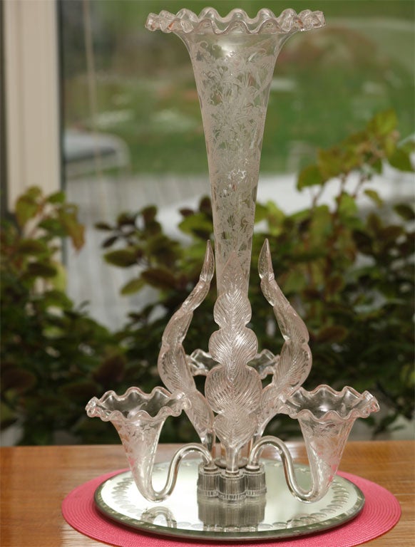 Incredible handblown crystal epergne or centerpiece with all-over wheel cut fern and leaf decoration, set in mirrored plateau-one of the largest and most impressive.