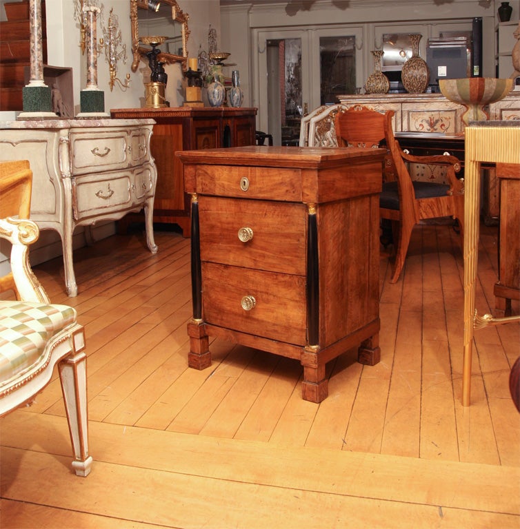 A Pair of Walnut Two Drawer Commodini