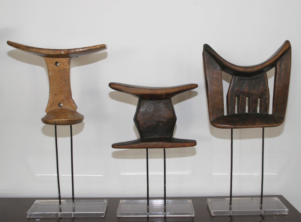 Afar Headrests, Ethiopia, Large. Hand-carved. Each has a highly unique presentation. Some have simple ornamention in the form of string, fabric, metal, or beads. Their sizes vary. These are large, ranging 8